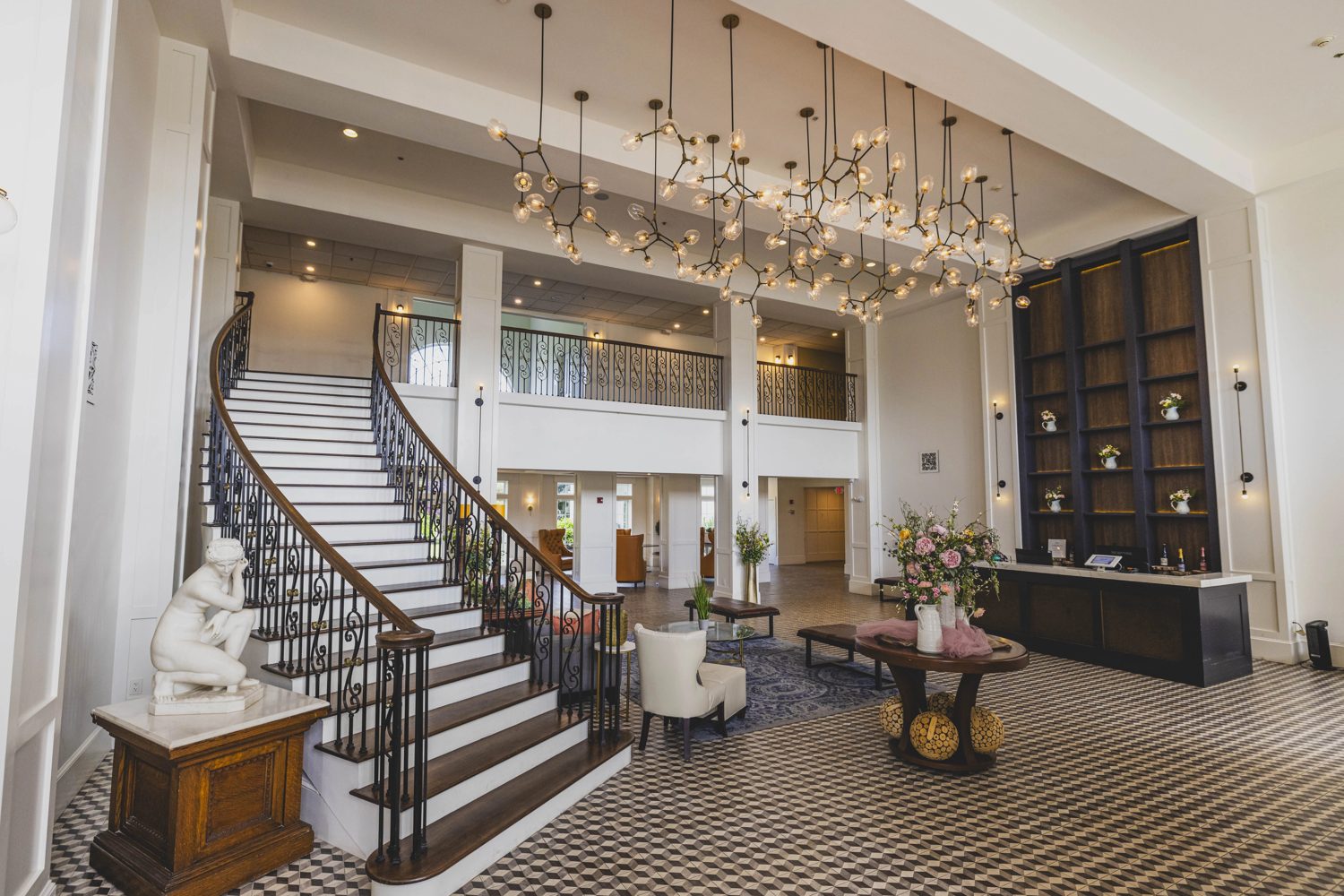 Grand resort lobby with a sweeping staircase